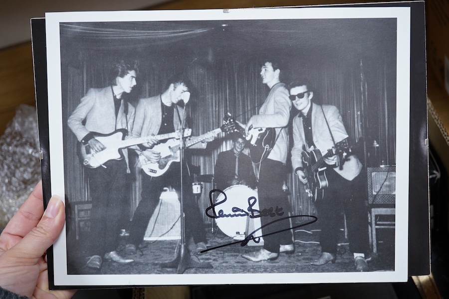 A collection of Beatles memorabilia including; models of a Beatles drum kit and eight miniature guitars and stands, each approx 25cm long, together with three boxed Corgi Beatles related models, including the Yellow Subm